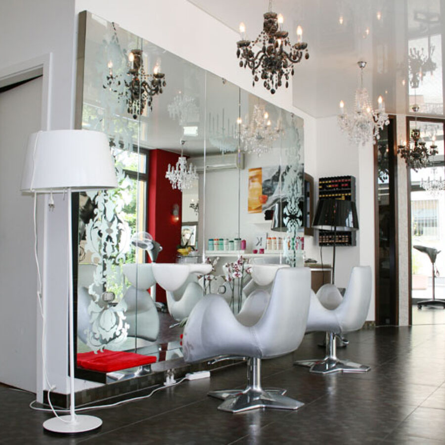 Styling stations with mirror and chandeliers