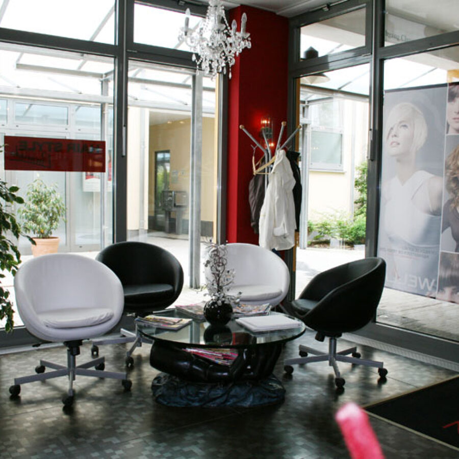 Waiting area with armchairs by the window